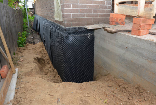 Happy homeowners after waterproofing job in Green Bay